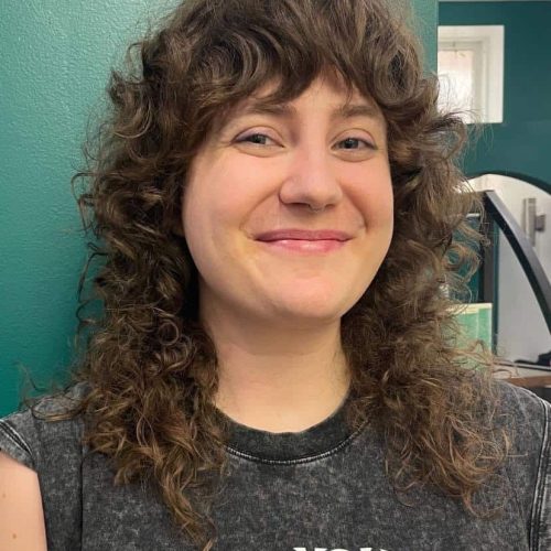 Shaggy Curly Haircut With Bangs For Natural Texture In Tower Grove