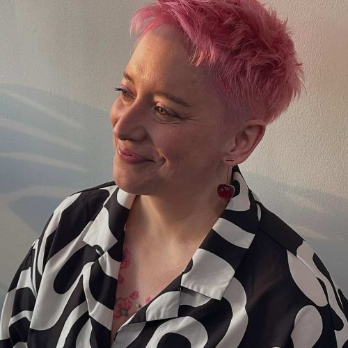 Vivid Coral Toned Haircut For Short Hair In St Louis Aveda Salon